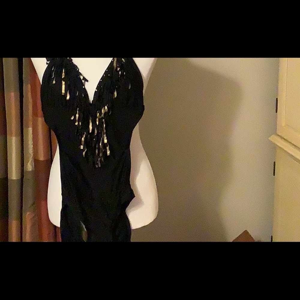 Black on piece bathing suite with tie neck and open sides and back.